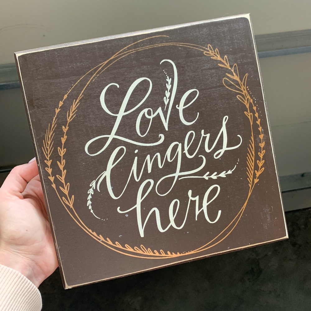 Love lingers here sign